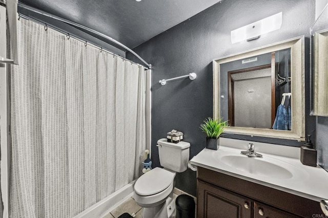 bathroom featuring a shower with shower curtain, vanity, toilet, and tile patterned flooring