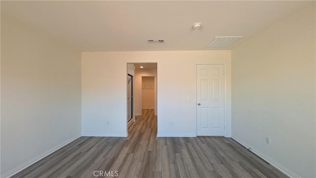 spare room featuring dark hardwood / wood-style floors