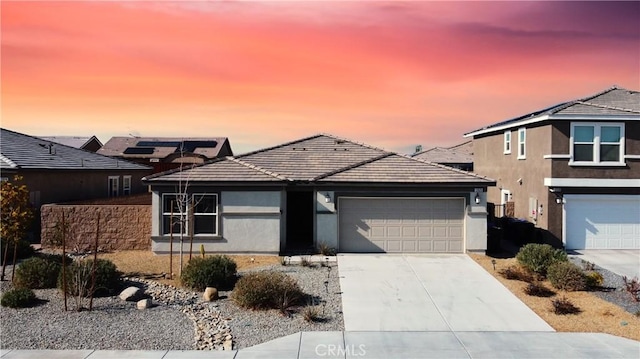 view of front of property with a garage