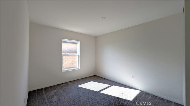 empty room featuring carpet floors