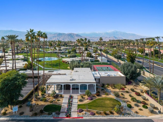 birds eye view of property with a mountain view