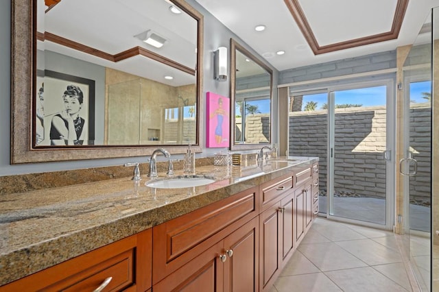 bathroom with crown molding, vanity, a raised ceiling, and walk in shower