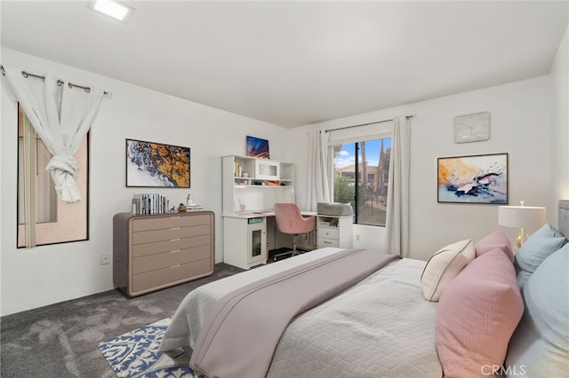 bedroom with dark carpet