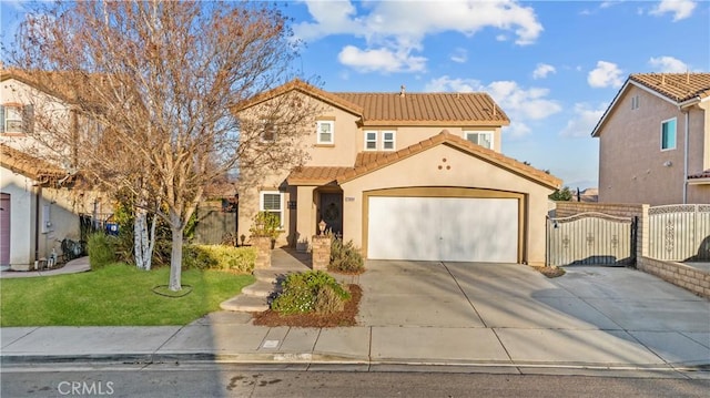 mediterranean / spanish-style house with a garage, concrete driveway, a tile roof, a gate, and stucco siding