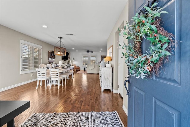 foyer featuring dark hardwood / wood-style flooring and ceiling fan