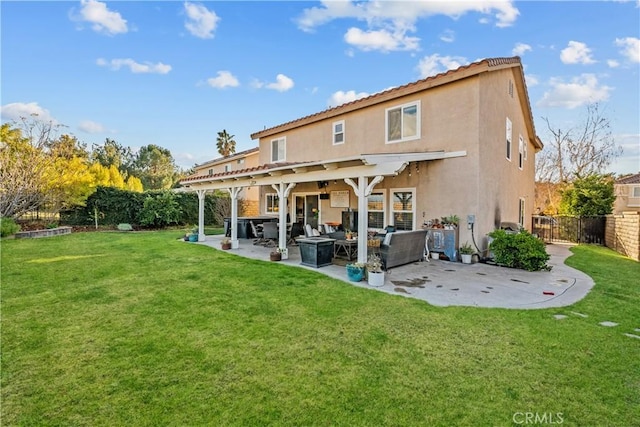 rear view of property featuring a yard and a patio