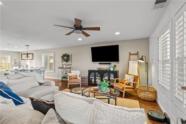 living room featuring recessed lighting, visible vents, ceiling fan, wood finished floors, and baseboards