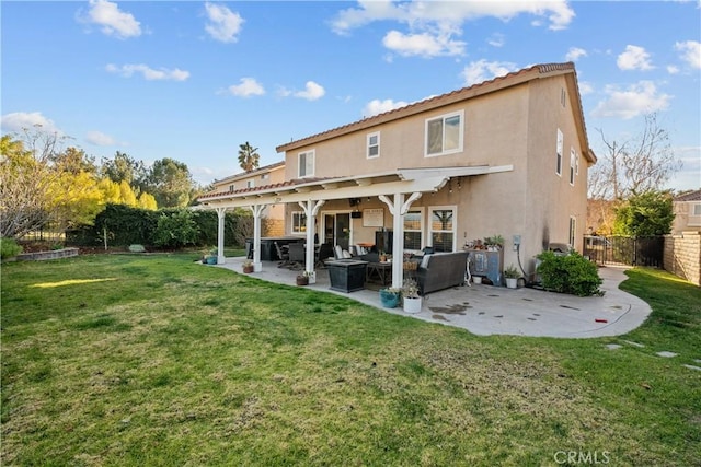 rear view of property featuring a fenced backyard, outdoor lounge area, a lawn, stucco siding, and a patio area