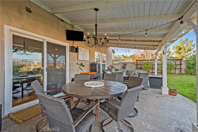 view of patio featuring fence and outdoor dining area