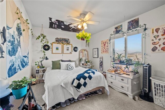 bedroom with ceiling fan and carpet