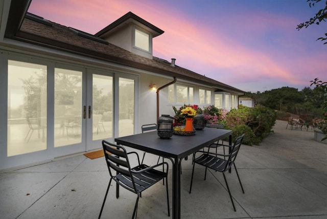 view of patio terrace at dusk