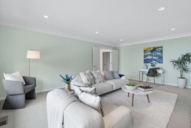 living room with ornamental molding and light carpet