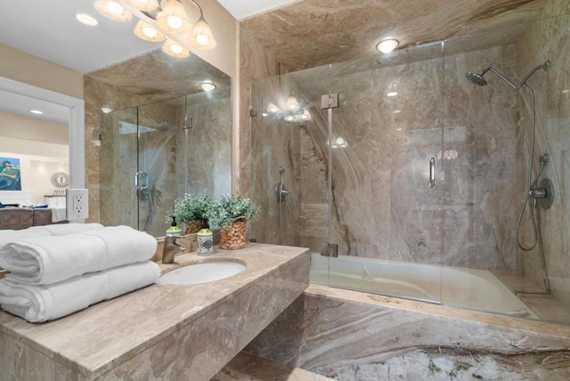 bathroom featuring sink and an enclosed shower