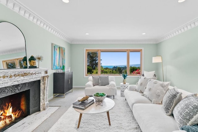 living room with light carpet, a fireplace, and ornamental molding