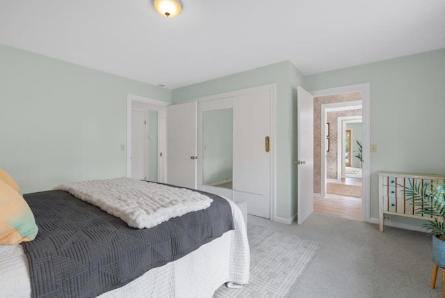 carpeted bedroom featuring a closet