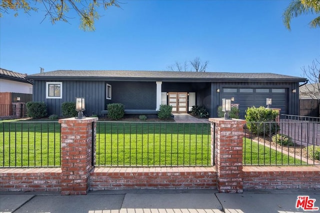 ranch-style house with a garage and a front lawn