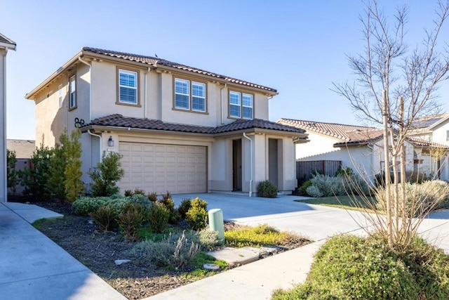 mediterranean / spanish-style home with a garage