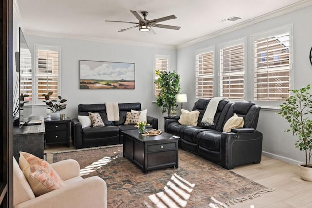 living room with crown molding, ceiling fan, and light wood-type flooring