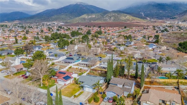 birds eye view of property featuring a mountain view