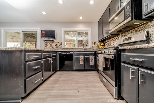 kitchen with tasteful backsplash, sink, and stainless steel appliances