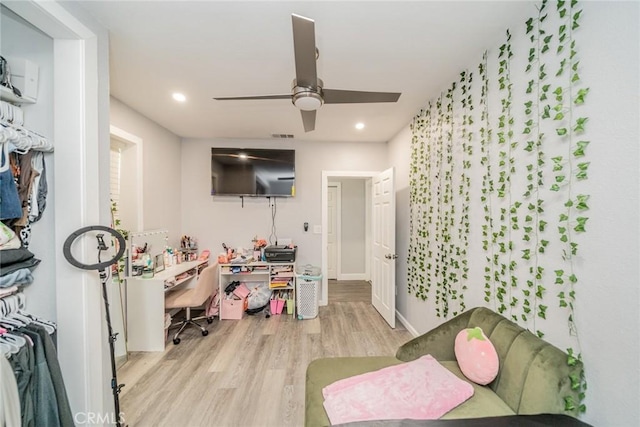 interior space featuring ceiling fan and light wood-type flooring