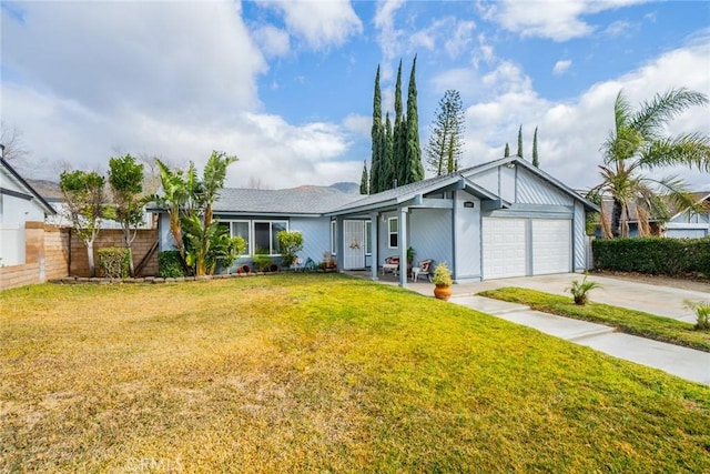 ranch-style house featuring a garage and a front lawn