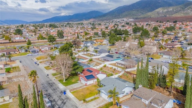 birds eye view of property featuring a mountain view