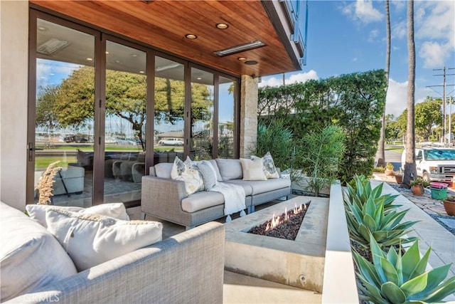 sunroom featuring wood ceiling