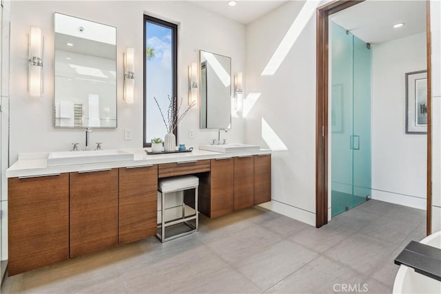 bathroom featuring vanity and walk in shower