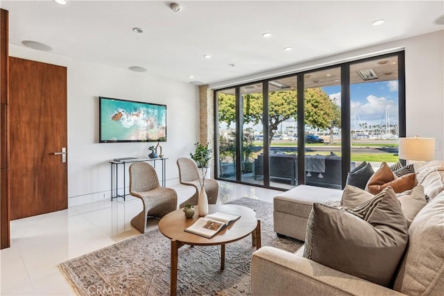 interior space featuring light tile patterned floors and expansive windows