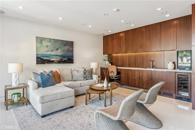 living room featuring beverage cooler and sink