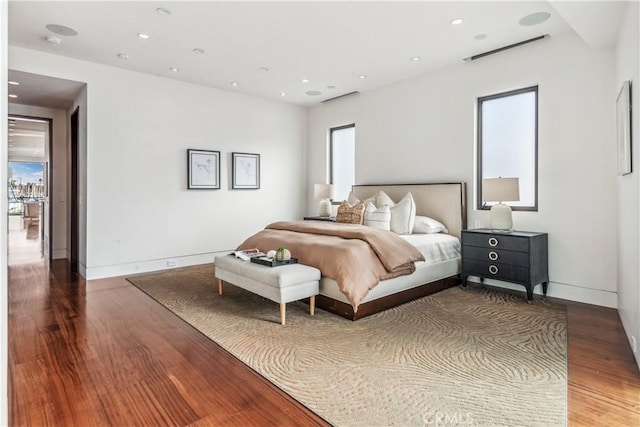 bedroom with hardwood / wood-style flooring