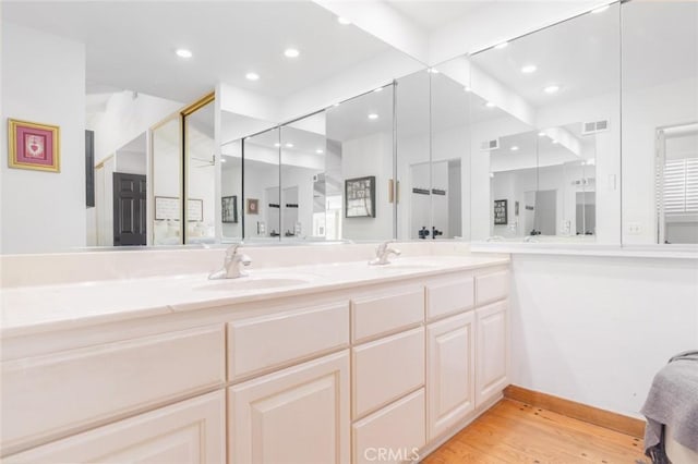 bathroom featuring wood-type flooring and vanity