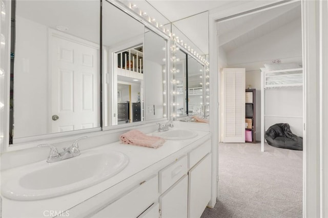 bathroom featuring vanity and vaulted ceiling