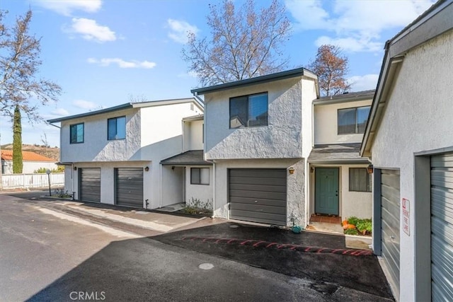 townhome / multi-family property featuring a garage