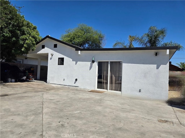 back of property featuring a patio