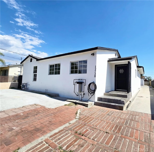 rear view of house with a patio