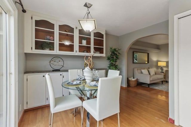 dining space featuring light wood-type flooring