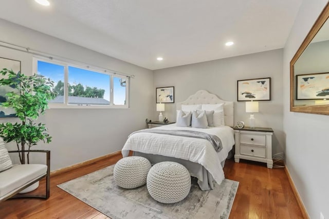 bedroom with dark wood-type flooring