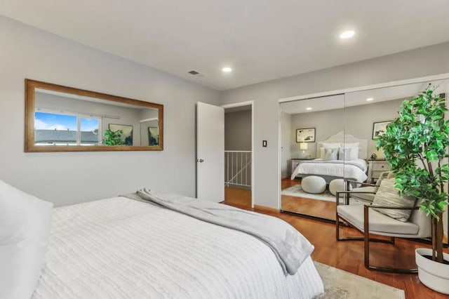 bedroom featuring hardwood / wood-style flooring and a closet