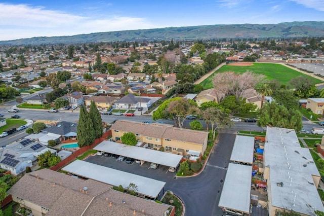 birds eye view of property featuring a mountain view