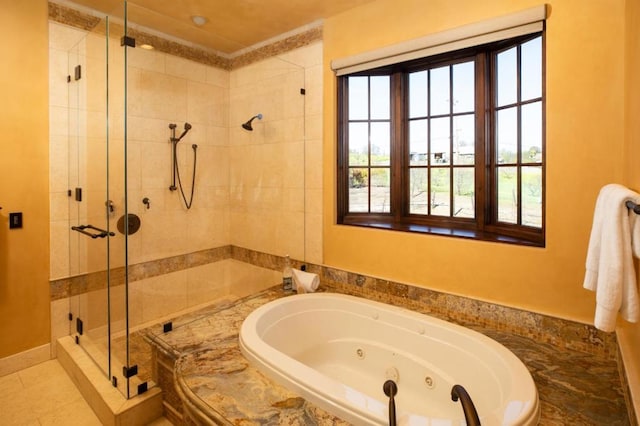 bathroom featuring separate shower and tub