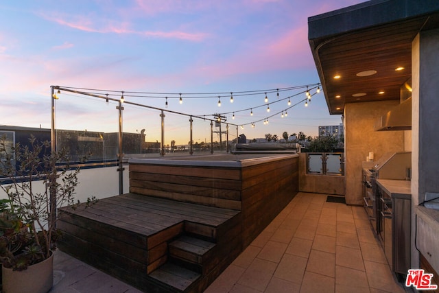 view of patio terrace at dusk