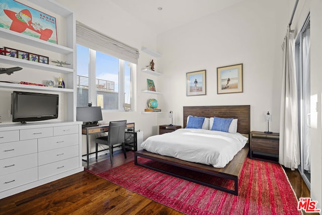 bedroom featuring dark wood-type flooring