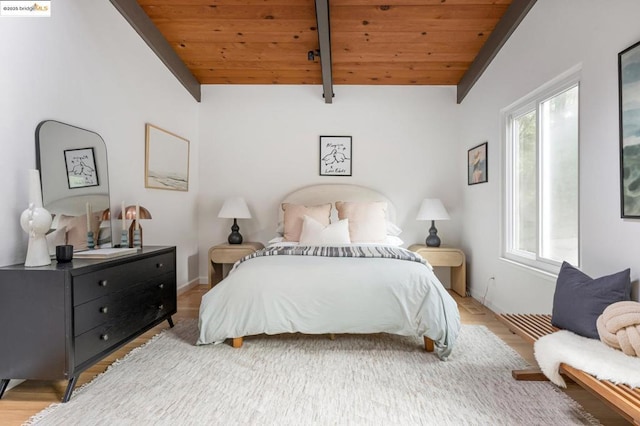 bedroom with wood ceiling, lofted ceiling with beams, and hardwood / wood-style floors