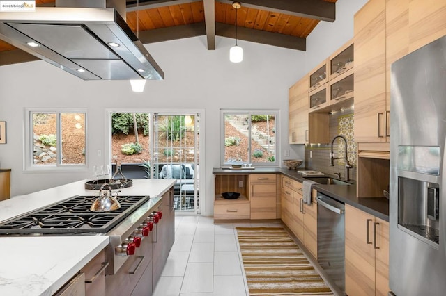 kitchen with light brown cabinetry, sink, hanging light fixtures, wooden ceiling, and stainless steel appliances