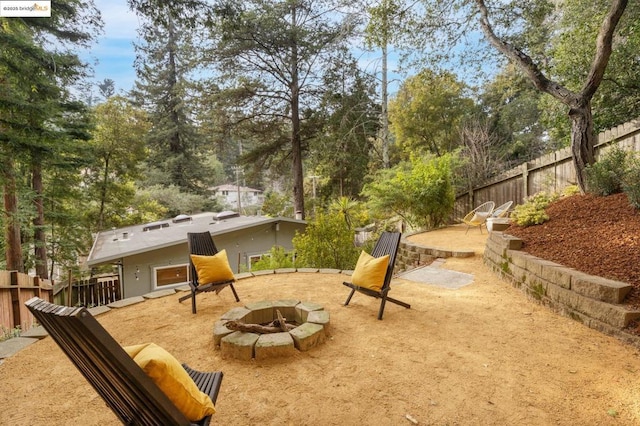 view of yard featuring a patio and a fire pit