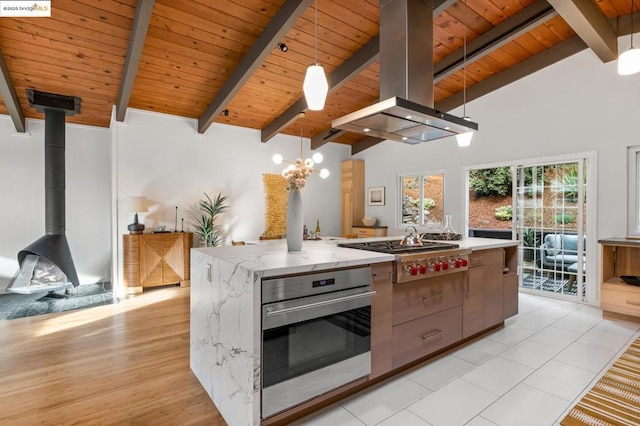 kitchen with island exhaust hood, hanging light fixtures, wooden ceiling, and appliances with stainless steel finishes