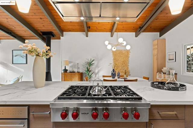 kitchen with light stone counters, wood ceiling, beamed ceiling, and stainless steel gas stovetop