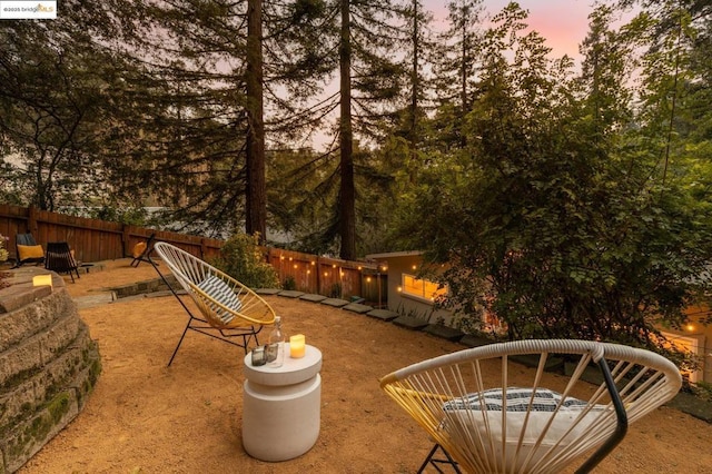 view of patio terrace at dusk